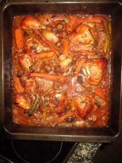 A picture of Baked Chicken thighs in potatoes.