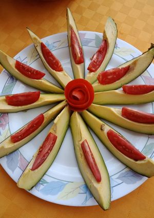 A picture of Tomato avocado salad.