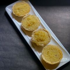 A picture of Hongkong style Coconut Tart with Lemon zest.