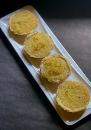 A picture of Hongkong style Coconut Tart with Lemon zest.