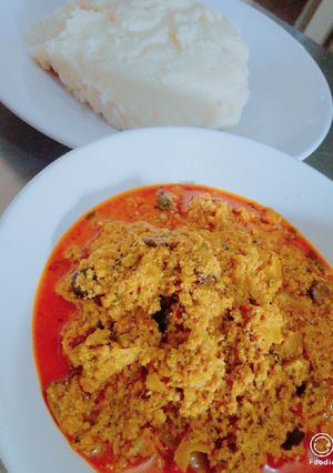 A picture of Ufia Anan (sesame soup) with maize and cassava pudding.