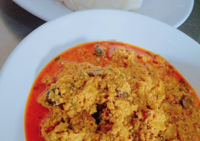 Ufia Anan (sesame soup) with maize and cassava pudding