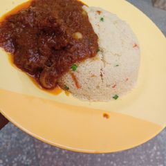 Garnished couscous with beef stew A picture of Garnished couscous with beef stew.