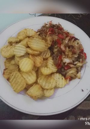 A picture of Fried potatoes and cabbage sauces.