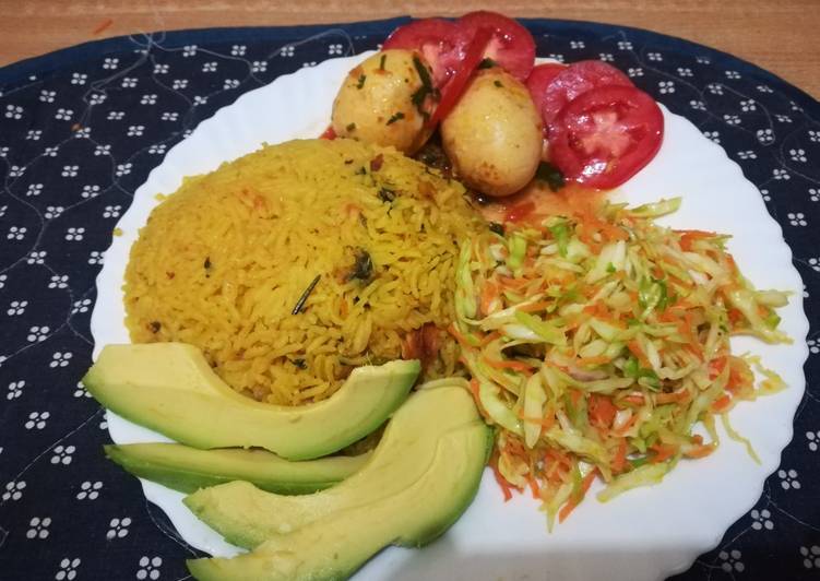 Tumeric rice with sausages, egg curry and salad