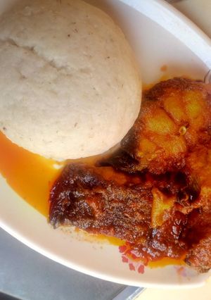 A picture of Tuwon Rice and Tomato soup with Tilapia fish.