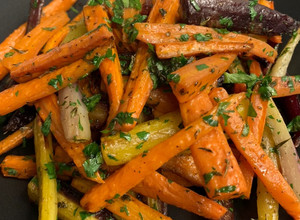 A picture of Roasted Carrots with Thyme, Oregano, and Parsley.