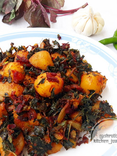 A picture of Sauteed baby potatoes with beetroot and amaranth leaves.
