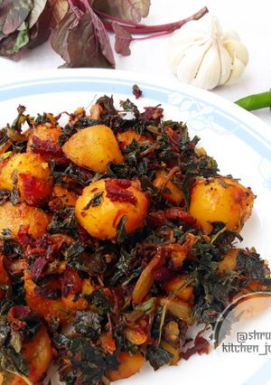 A picture of Sauteed baby potatoes with beetroot and amaranth leaves.