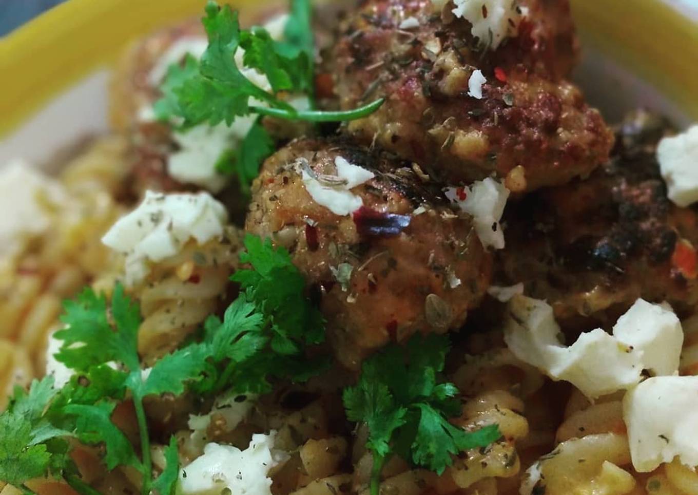 Mutton meat balls and fusilli pasta in tomato emulsion