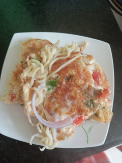 A picture of Eggs omellete with indomie.