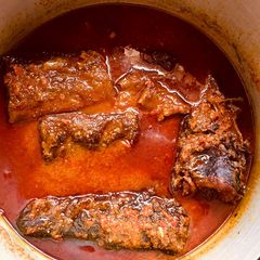 A picture of Palm oil stew with fish🌶🍅🧅.
