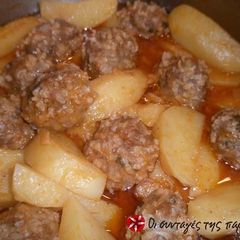 A picture of Giouvarlakia with tomato sauce.
