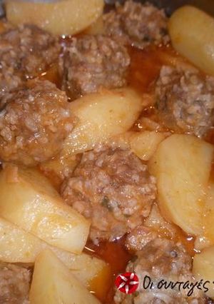 A picture of Giouvarlakia with tomato sauce.