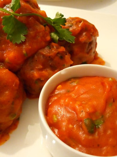 A picture of Meatballs With sauce.