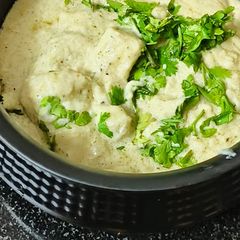 A picture of Kali mirch cashew paneer (in white gravy).