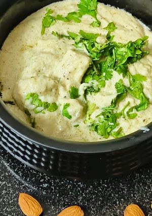 A picture of Kali mirch cashew paneer (in white gravy).