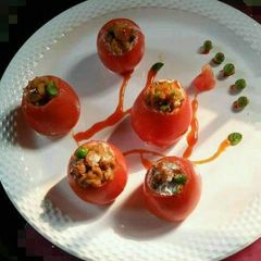 A picture of Stuffed tomatoes steam.