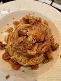 Spaghetti cù li meli e muddicca atturrata, origine siciliana