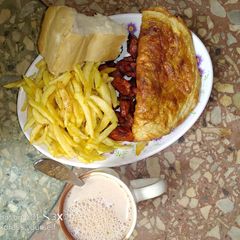 A picture of Fried Irish potato,fried plantain and egg.