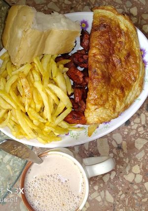 A picture of Fried Irish potato,fried plantain and egg.