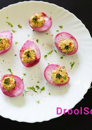 A picture of Beetroot pickled deviled eggs.