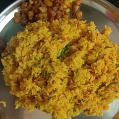 A picture of Dal rice with potato fry.