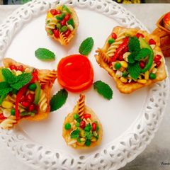 Crispy Edible Diyas filled with Pasta Chat A picture of Crispy Edible Diyas filled with Pasta Chat.