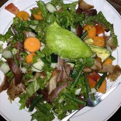 A picture of Grilled chicken with vegetables.