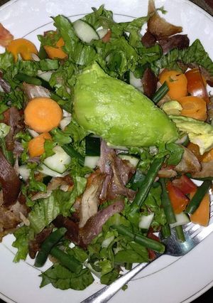 A picture of Grilled chicken with vegetables.