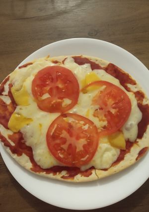 Una foto de Pizza casera 3 quesos