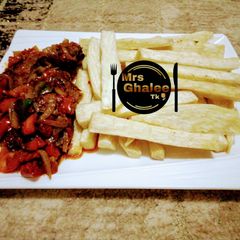 A picture of Fried yam with tomatoes sauce.