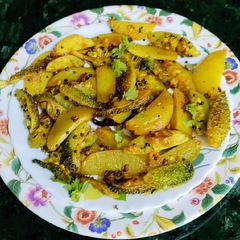 A picture of Spiny Gourd(Kantola) Potato Fry(no onion garlic).