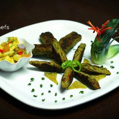 A picture of Pesto chicken seekh kabab.