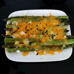 A picture of My Grilled Asparagus with Cheese Melted Over and Spring Onion.