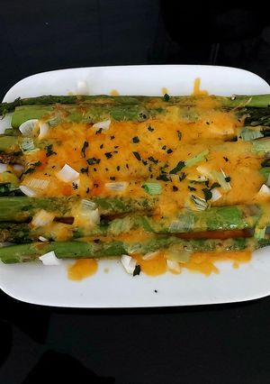 A picture of My Grilled Asparagus with Cheese Melted Over and Spring Onion.