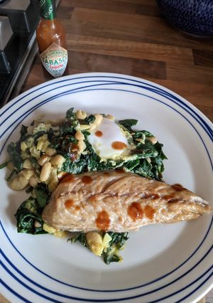 A picture of Iranian style eggs with smoked mackerel.