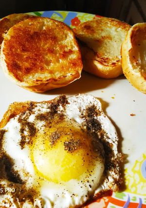 A picture of Half fry egg with Crispy Pav.