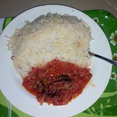 A picture of Rice and spag with dried fish stew.