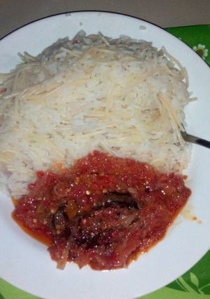 A picture of Rice and spag with dried fish stew.