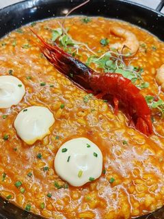 Una foto de Arroz caldoso con carabineros