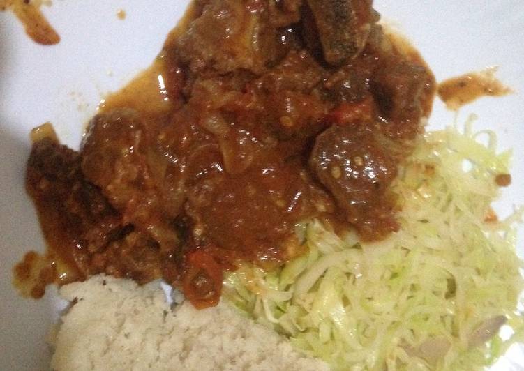 Ugali wa Mala served with fried beef and cabbage