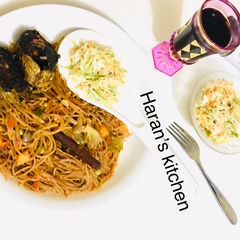 A picture of Brown spaghetti with veggies.