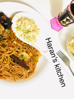 A picture of Brown spaghetti with veggies.