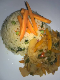 A picture of White fried rice with potato and vegetable soup.