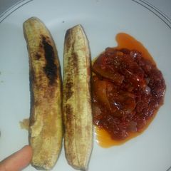 A picture of Roasted Plantain and pomo sauce. #abuja.