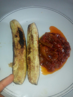 A picture of Roasted Plantain and pomo sauce. #abuja.