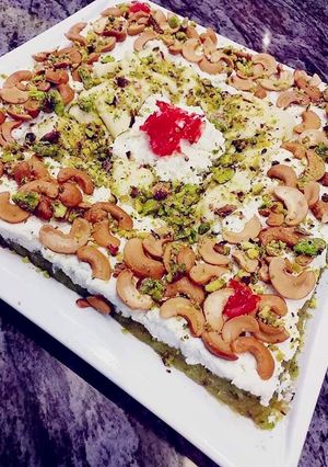 صورة لوصفة الملدلوقة بالقشطة العربية والمكسرات
