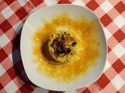 Una foto di risotto zucchine formaggio