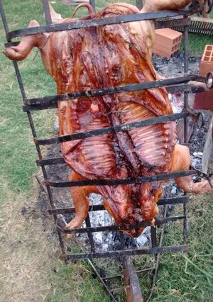 Una foto de Asado a la cruz de lechón